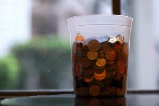 Plastic container of coins