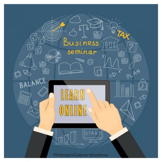 Cartoon hand holding tablet saying "Learn Online" surrounded by small drawings of business graphs, money, and words "Business seminar," "balace," "plan," "start"