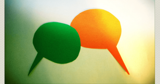 Two speech bubbles, one green and one orange