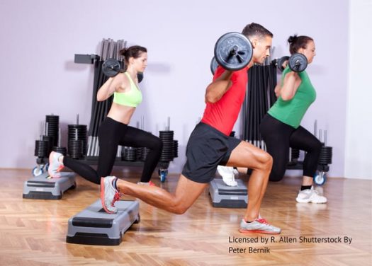 Man and women lifting weights