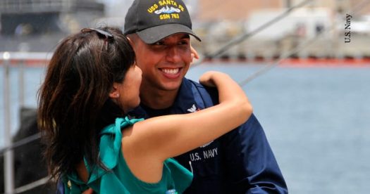 Sailor hugs girlfriend before deployment