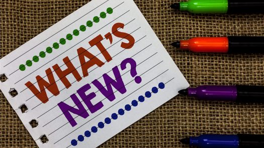 Lined notebook paper with the words, "What's new?" next to colored markers