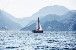 Sail boat on water in the mountains