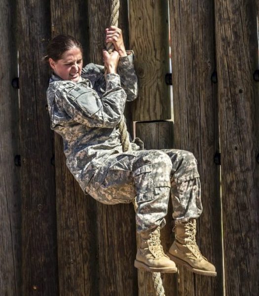 woman soldier climbing rope