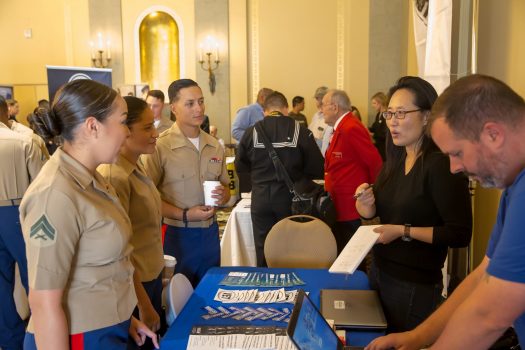U.S. Marines with Combat Logistics Battalion 11, Headquarters Regiment, 1st Marine Logistics Group talk with Military.com during a veterans resource fair at the Marines’ Memorial Hotel Oct. 3, 2017 in San Francisco during San Francisco Fleet Week