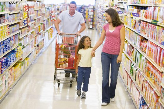 Family walking down grocery store aisle