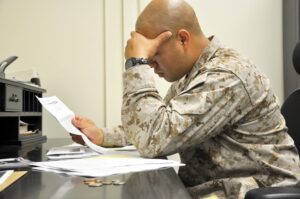 A Marine may be able to keep his or her calm in a combat zone but on the home front there are still many looming threats, including financial security that can bring even the most iron willed warriors into a stressed environment. Photo by Cpl. Thomas Bricker. CC BY 2.0