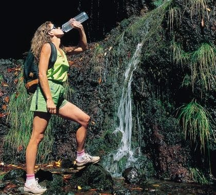Hiker stopping to take a drink of water