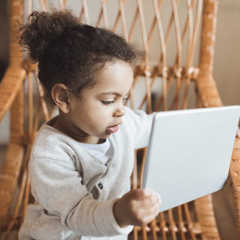 young girl looking at tablet