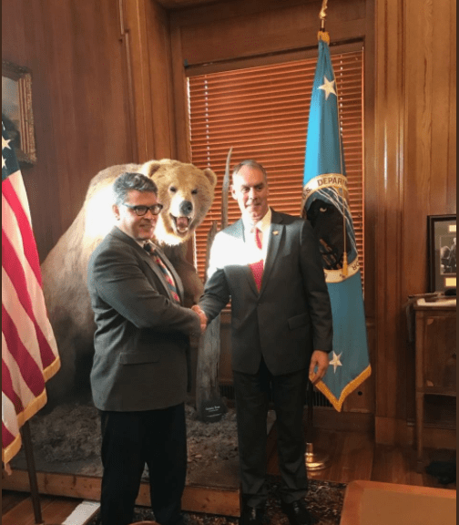 Dr. Keith Tidball shaking hands with Secretary of the Interior Ryan Zinke