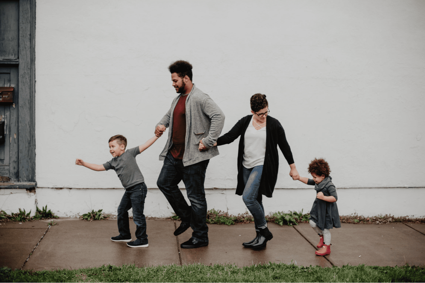 Family Of Four Walking on the sidewalk