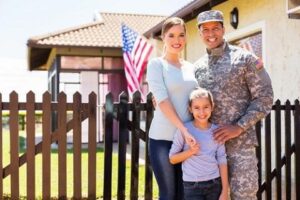 Military Dad with wife and daughter