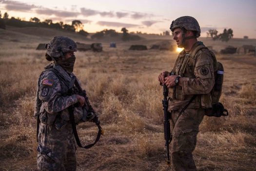Army Reserve Cpl. Vanessa Lebold, left, and Spc. Jasper Devin discuss patrolling techniques after a reconnaissance patrol during a combat support training exercise at Fort Hunter Liggett