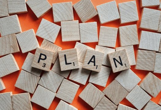 Scrabble letters spell "plan"