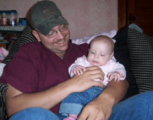 Father holding infant
