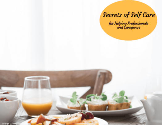 Table with healthy meal under the words, "Secrets of Self Care: for Helping Professionals and Caregivers"