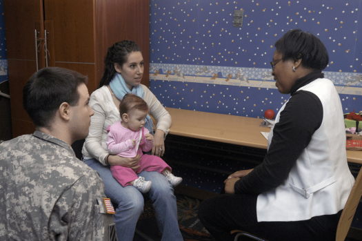 Military family talking to professional