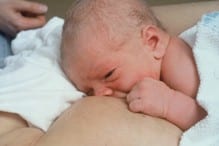 Newborn baby breastfeeding