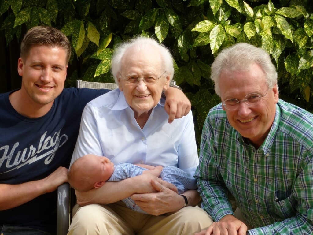 Four generations of men and a newborn.