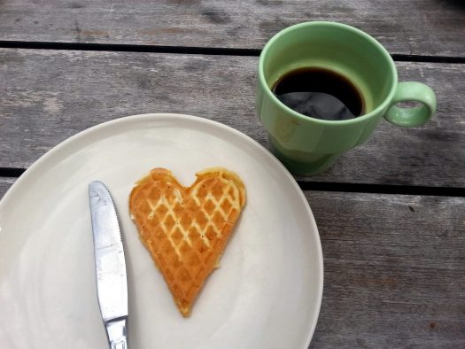 Heart-shaped waffle with coffee mug