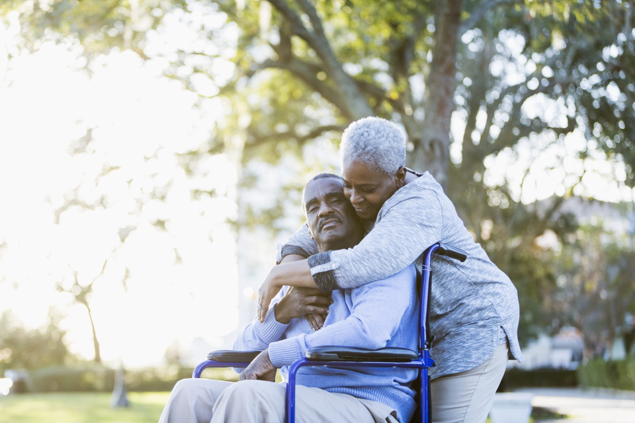 Senior African American couple, man in wheelchair