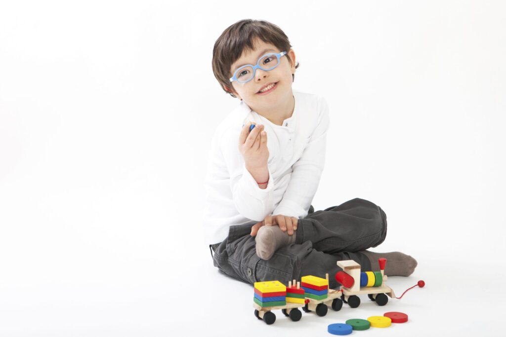 Boy with Down Syndrome playing