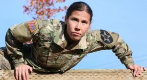 woman soldier climbing