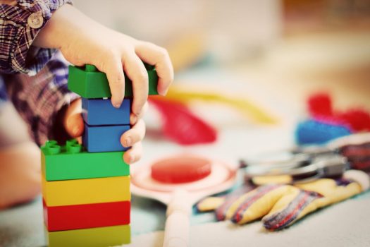 Child assembling building blocks