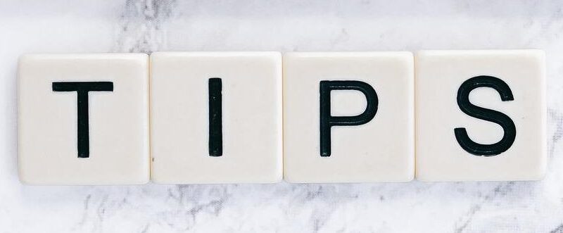 Scrabble Game tile letters spell out the word TIPS