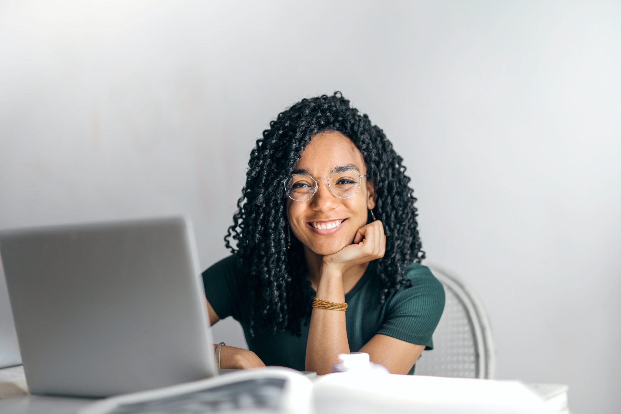 Woman smiling in front of computer