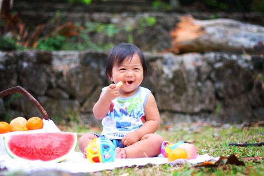 Baby eating at picnic