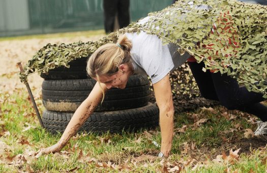 Soldier working through obstacle course