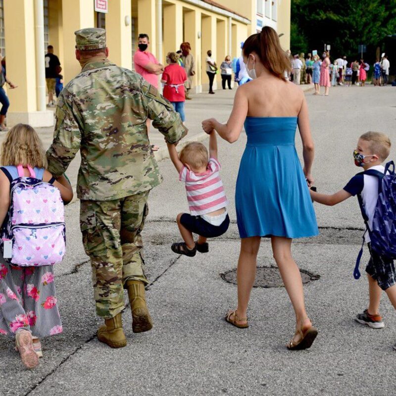 Air Force Father walking his children to school with their mother