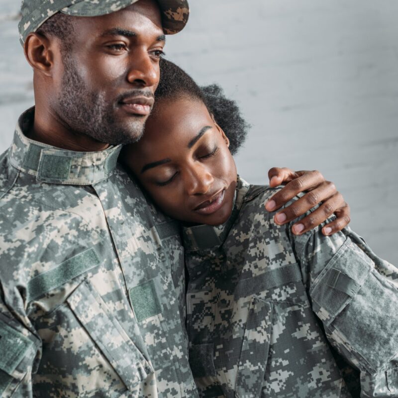 Military couple with arm around eachother