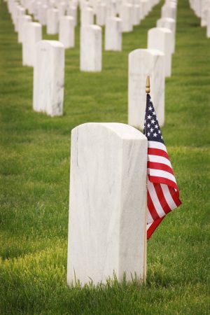 Military cemetery with American flag