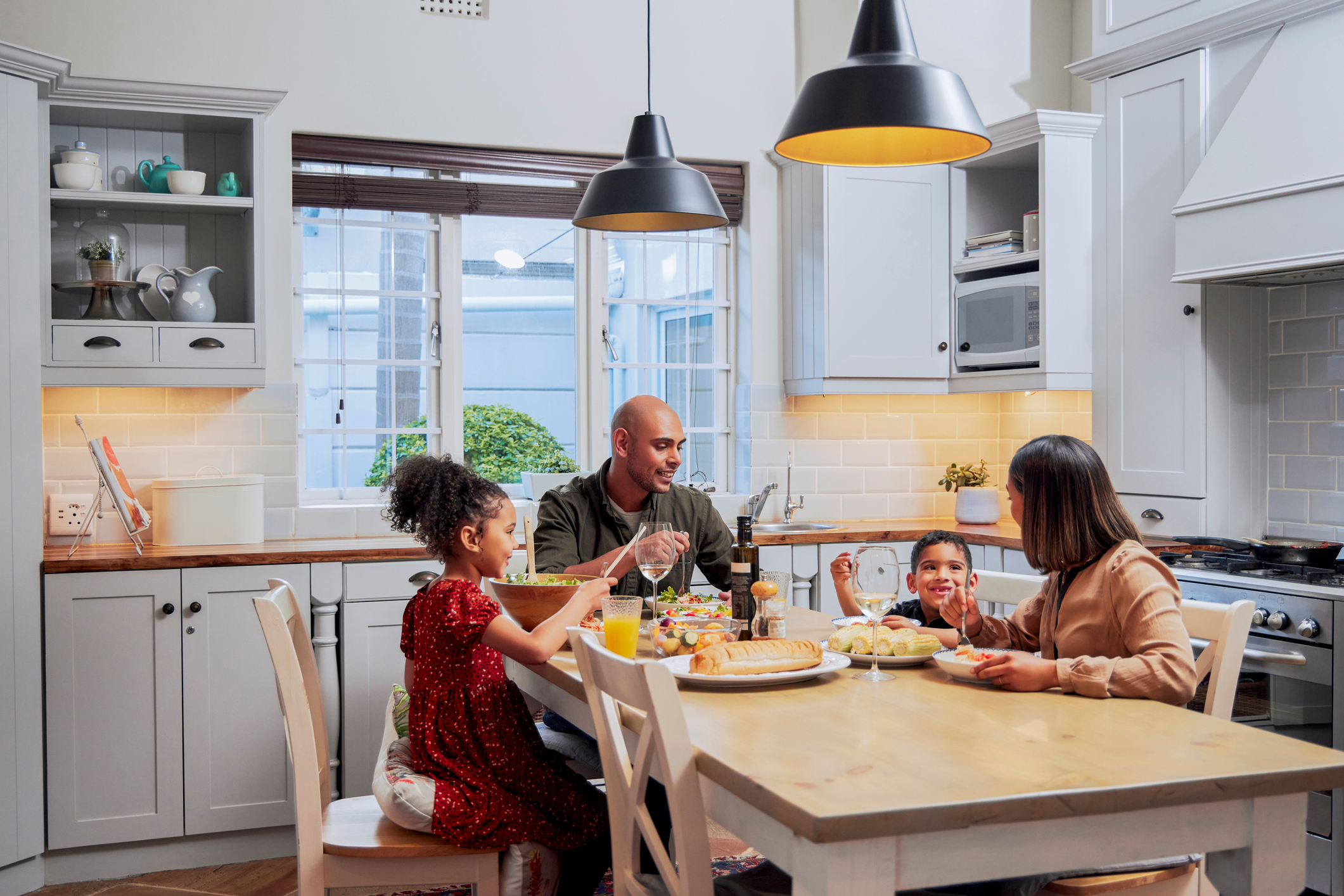 Shot of a young family enjoying a meal together