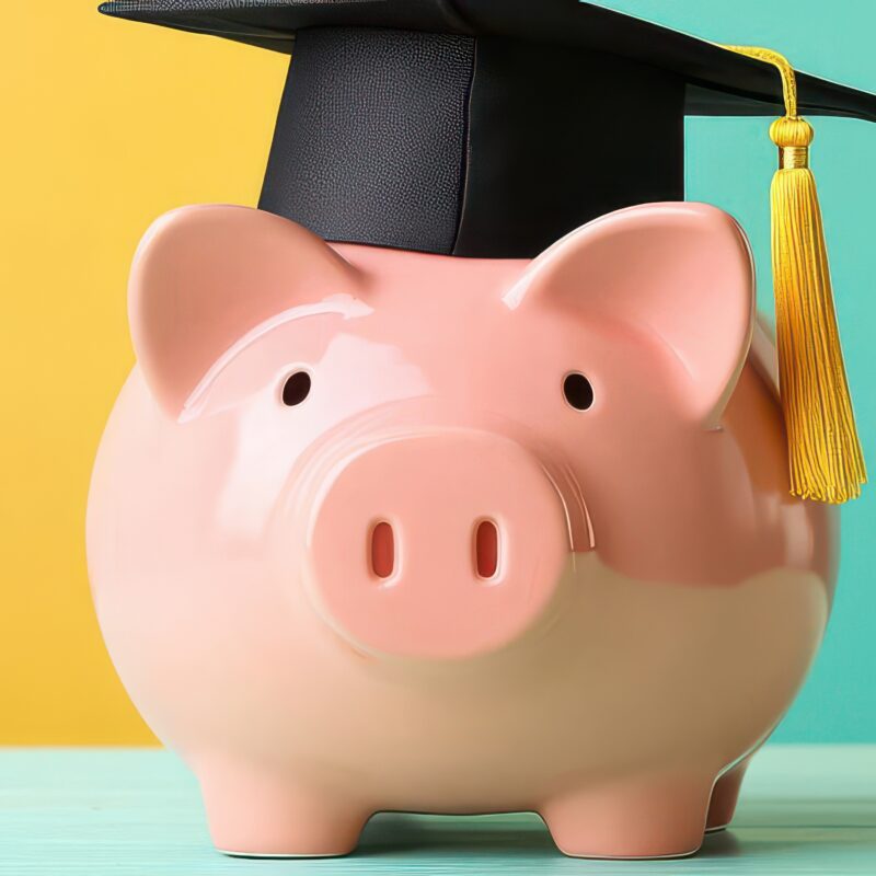 Piggy bank wearing a graduation cap