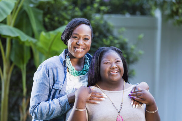 An African-American woman in her 30s standing with her