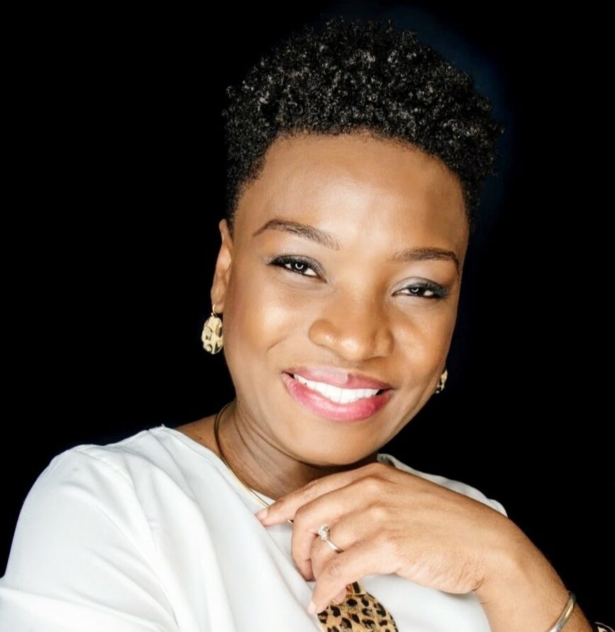 Image of Ms. McAllister-Blyden a middle aged black woman with short dark curly hair