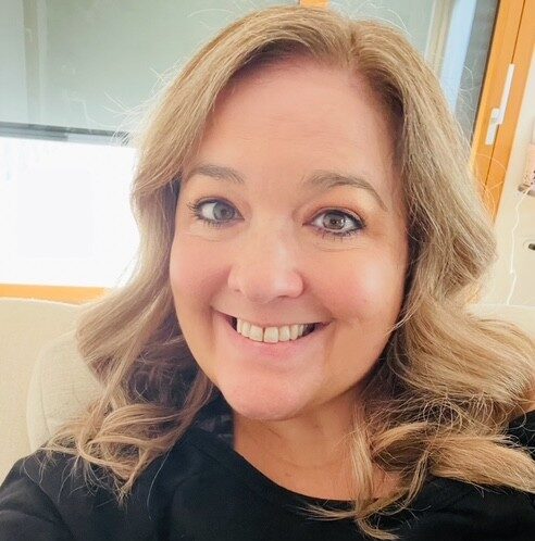 Image of Ashely Simpson a white middle aged woman with blonde wavy hair