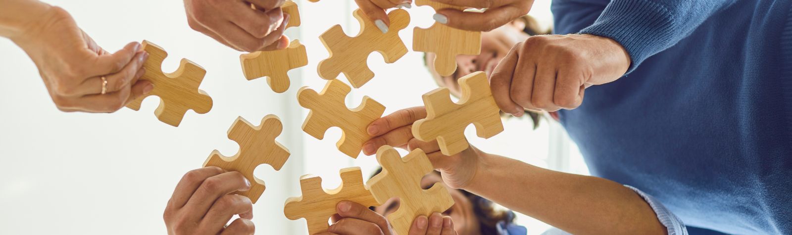 a group of people with puzzle pieces