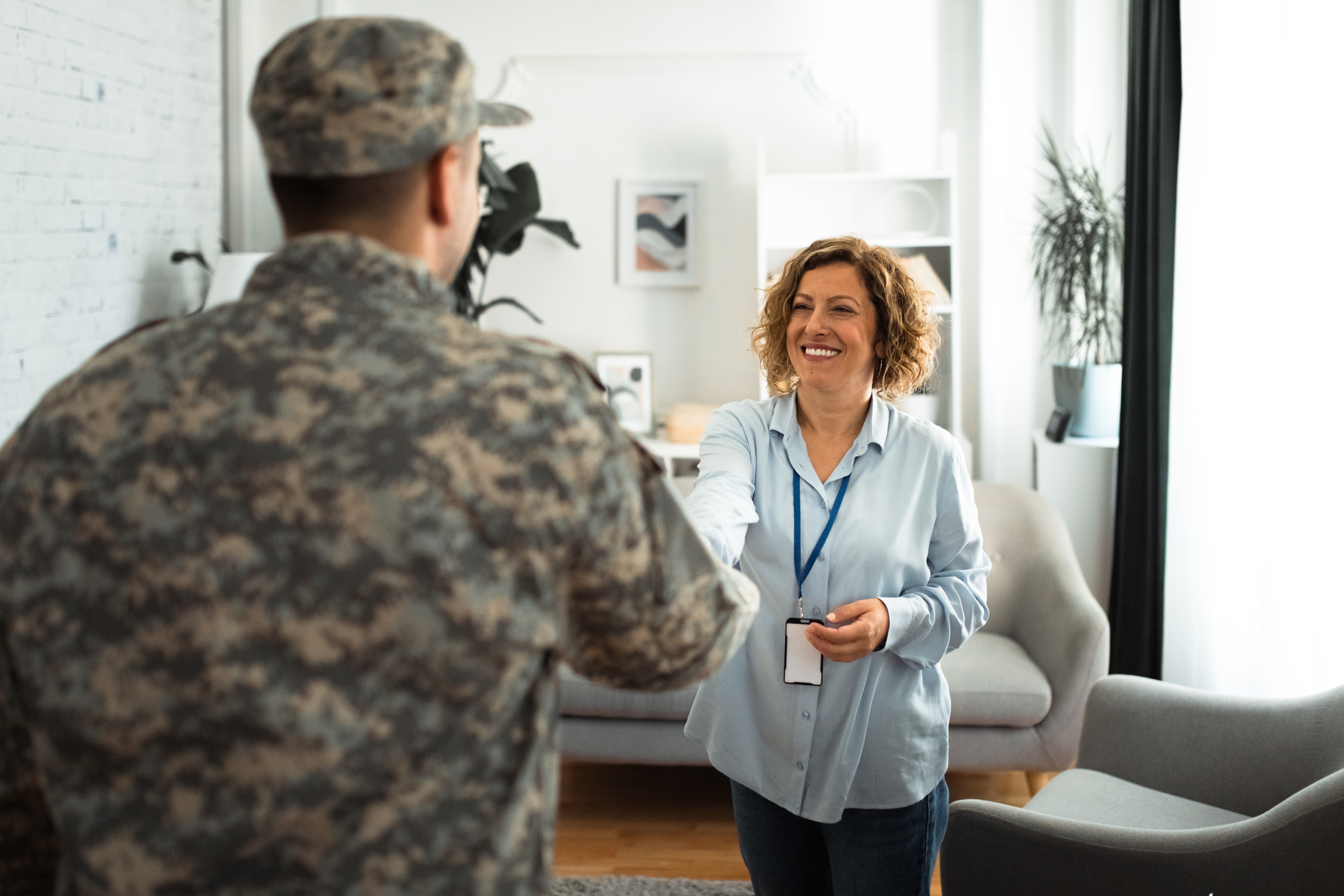 Handshake between service provider and military service member.