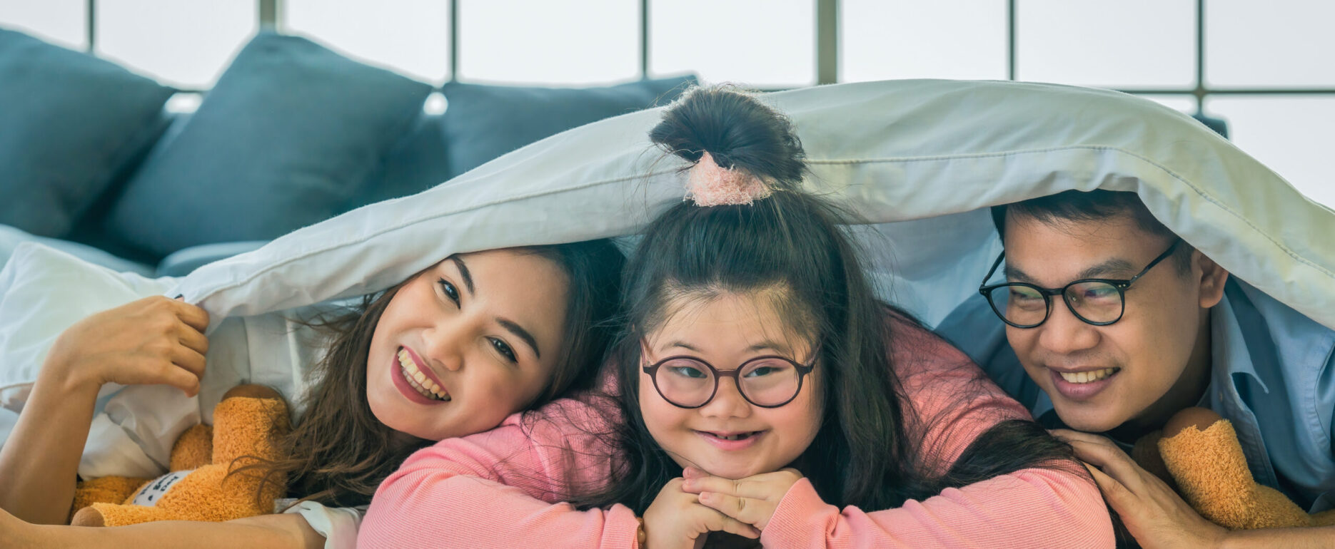 down syndrome teenage girl having good time together with family