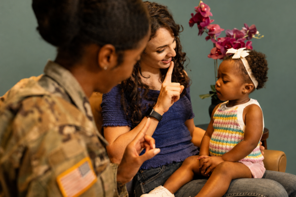 service provider working with young child and service member
